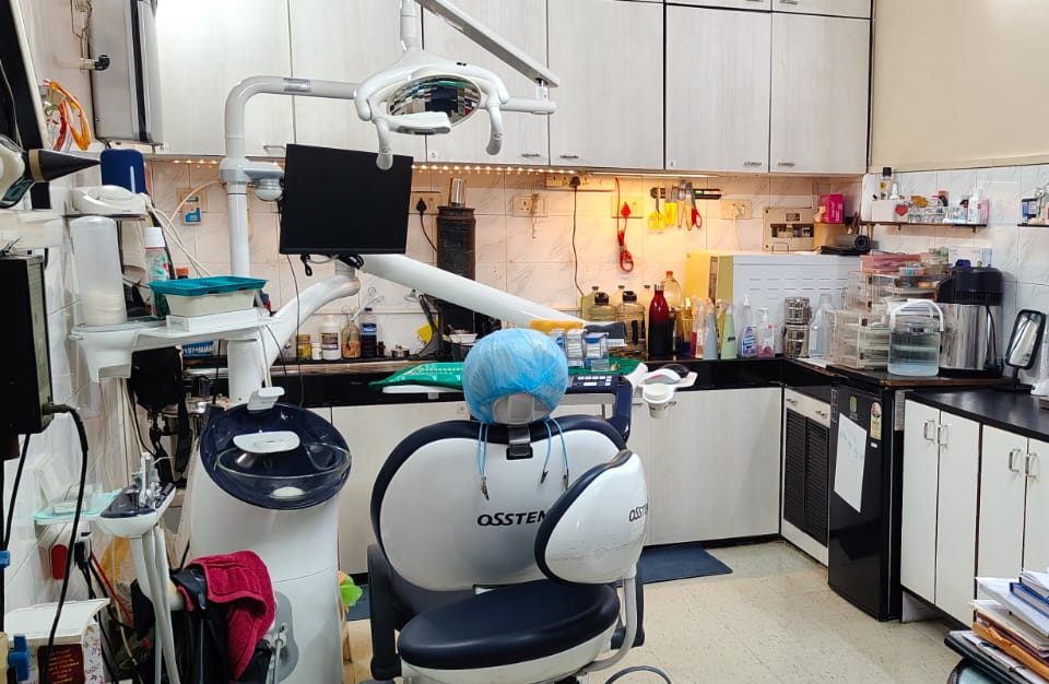 Treatment room with a modern patient chair at Pinak Dental Clinic
